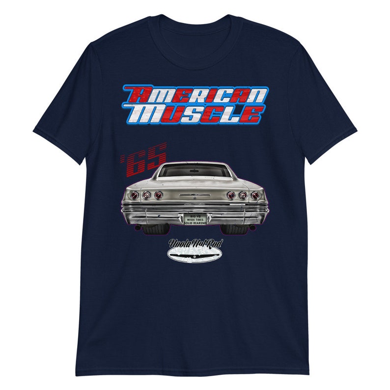 May include: Navy blue t-shirt with a red, white, and blue "American Muscle" graphic. The graphic also includes a silver 1965 Chevrolet Impala with red "Uncle Hot Rod" text.