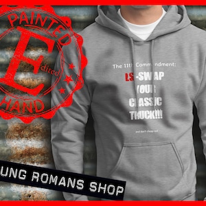 May include: Grey hooded sweatshirt with the text "The 11th Commandment: LS-SWAP YOUR CLASSIC TRUCK!!! and don't cheap out" printed in white. The text "PAINTED BY HAND" is in a red circle on the left side of the image.