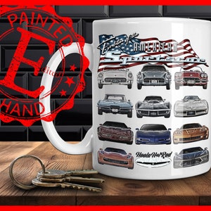 May include: White ceramic mug with a design of various American sports cars, including the Corvette, with an American flag and the text "Evolution of the American Sportscar" and "Hoola Hot Rod".