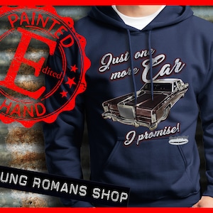 May include: Navy blue hoodie with a vintage car graphic and the text "Just one more car I promise!" printed on the front. The graphic is hand-painted and features a brown car with a white roof.