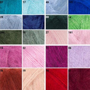 May include: A grid of yarn skeins in various colors. The colors include shades of blue, green, pink, purple, and red. Each skein is labeled with a number. The yarn appears soft and fluffy, suitable for knitting or crochet projects.