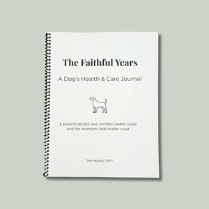 May include: A white spiral-bound journal titled "The Faithful Years: A Dog's Health & Care Journal." The cover features a line drawing of a dog and text that reads, "A place to record care, comfort, health notes, and the moments that matter most." The journal is on a light green background.