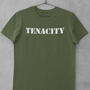 May include: A green short-sleeved t-shirt with the word "TENACITY" printed in white on the front.
