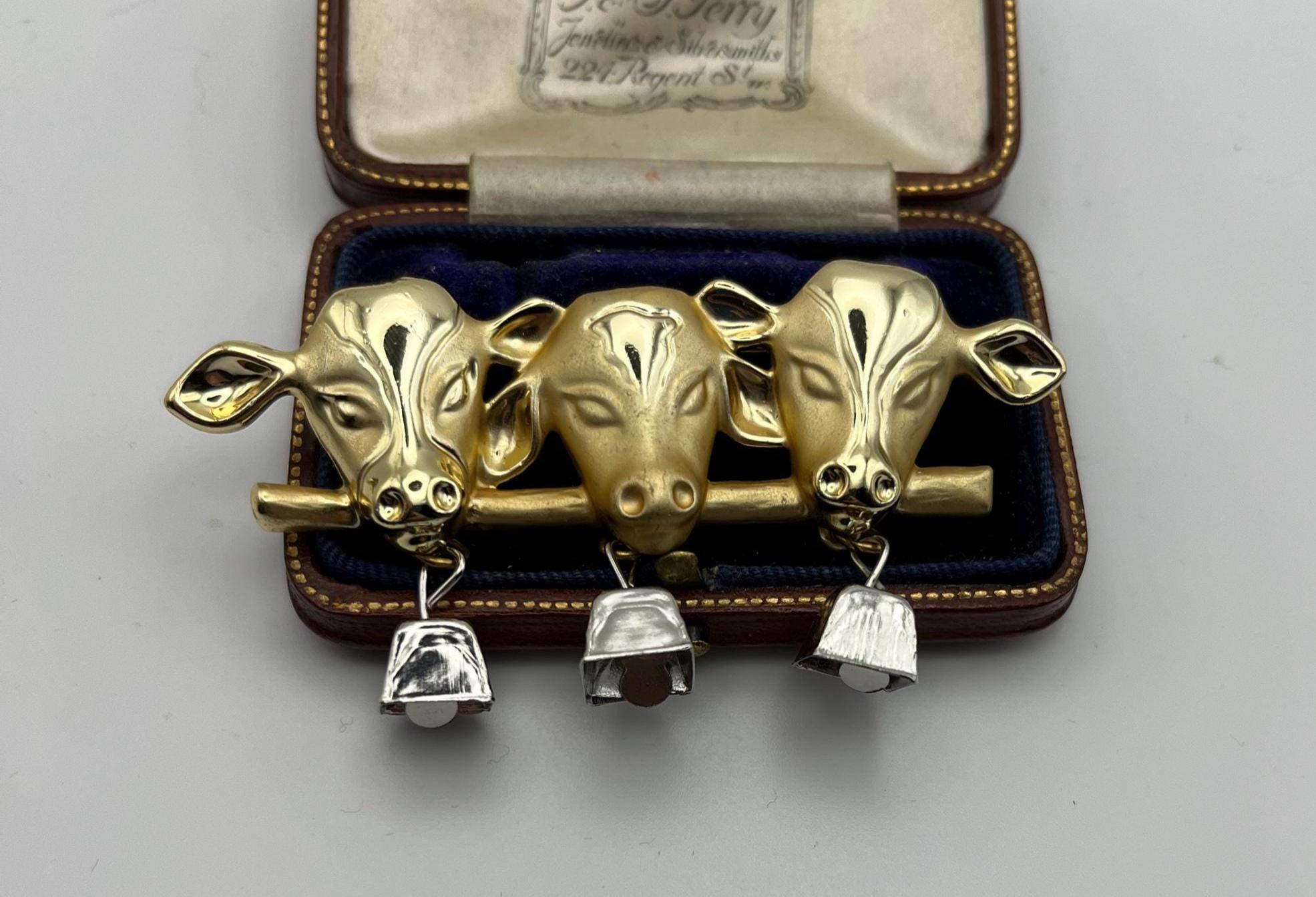 Vintage AJC 3 Cow Heads With Chiming Bells Brooch - Etsy 1980s Signed AJC Three Cow Head With Dangling Silver Tone Bells Brooch main image 1