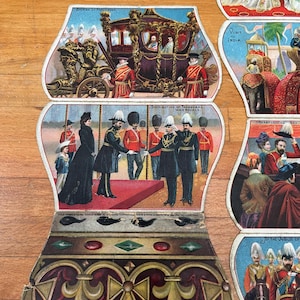 Antica cartolina pieghevole del 1901 della Regina Vittoria con scene del suo regno