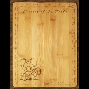 May include: A wooden cutting board with the text "Cheeses of the World" engraved on it. The board is decorated with a cartoon mouse holding a piece of cheese. The board has a list of different types of cheese engraved around the edges.