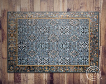 Könnte beinhalten: Ein blauer und goldfarbener Teppich mit einem detaillierten Blumenmuster. Der Teppich hat einen Rand mit einem sich wiederholenden Muster aus Blättern und Blumen.