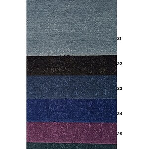 May include: Six fabric swatches in various shades of blue, black, purple, and green. The swatches are arranged vertically, with the lightest shade at the top and the darkest shade at the bottom.