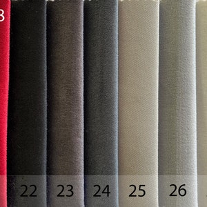May include: Fabric swatches in eight different colours, including red, black, grey, and beige. The swatches are labelled with numbers 20 through 28. The text "ROK|E-18" is at the top of the image, and the text "ROK" is at the bottom right.