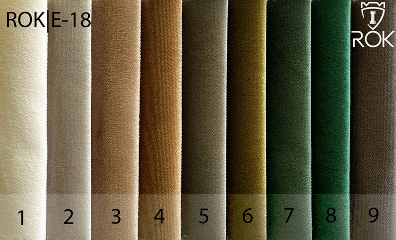 May include: Nine fabric swatches in various shades of beige, brown, green, and dark brown. The swatches are labelled with numbers 1 through 9. The text "ROK|E-18" appears in the top left corner of the image. The text "ROK" appears in the top right corner of the image.