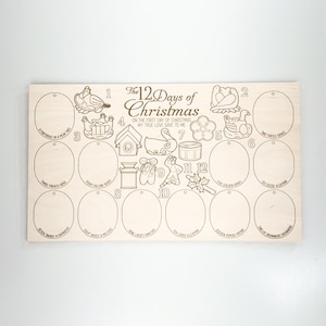 May include: A wooden 12 Days of Christmas ornament set with 12 blank circles for adding personalized ornaments. Each circle has a number from 1 to 12 and a corresponding illustration from the song.