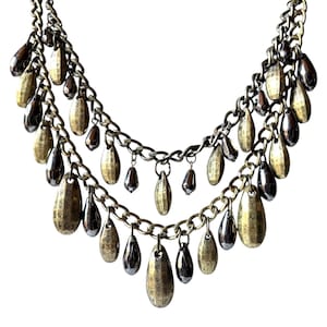 Colar de babador vintage com contas de bronze: joia com estilo boho robusto