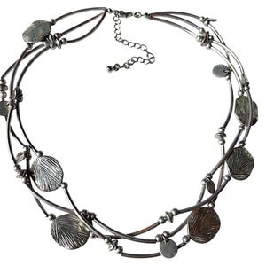 May include: Silver-toned necklace featuring a multi-strand design. The necklace has a series of textured, circular pendants and small, round beads. The adjustable chain allows for a customized fit. This piece is a stylish accessory.