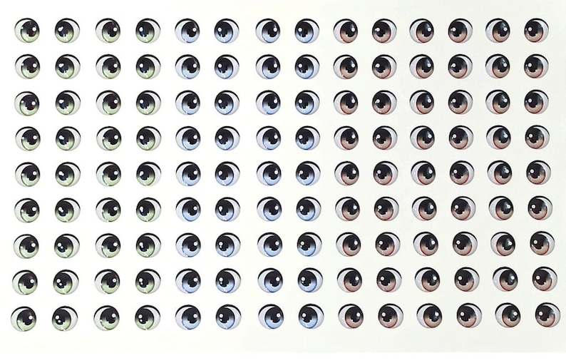 K&ouml;nnte beinhalten: Eine Blatt mit 100 selbstklebenden Glitz Augen in verschiedenen Farben und Gr&ouml;&szlig;en. Die Augen sind in Reihen und Spalten auf einem wei&szlig;en Hintergrund angeordnet. Die Augen sind schwarz, braun, blau und gr&uuml;n.