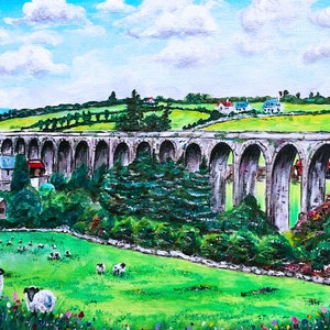 May include: A painting depicting a stone viaduct with numerous arches, situated against a backdrop of rolling green hills and a blue sky with white clouds. The viaduct is surrounded by verdant greenery, including trees and shrubs. In the foreground, a field of green grass is dotted with white sheep.