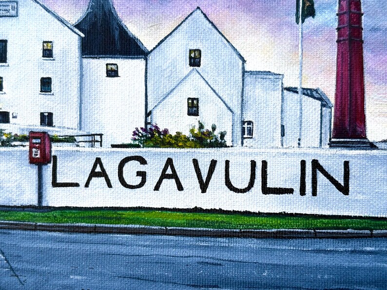 May include: An oil painting depicts a distillery with white buildings, a red smokestack, and a wall with the word "LAGAVULIN" in black letters. A red mailbox is visible on the left side of the image. The sky is a mix of purple and blue.
