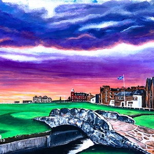 May include: A painting of a golf course with a stone bridge over a stream. The course is green and the sky is a vibrant purple and pink. There are buildings in the background, including a red building with a white spire.