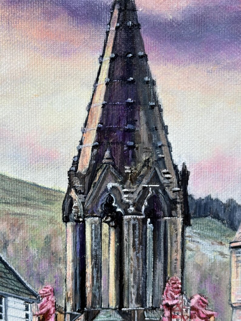May include: An oil painting of a church spire, rendered in dark hues, dominates the frame. The spire's intricate details are highlighted against a backdrop of a pastel sky. The artwork captures a serene landscape with hints of buildings and a hillside, showcasing a blend of colours.