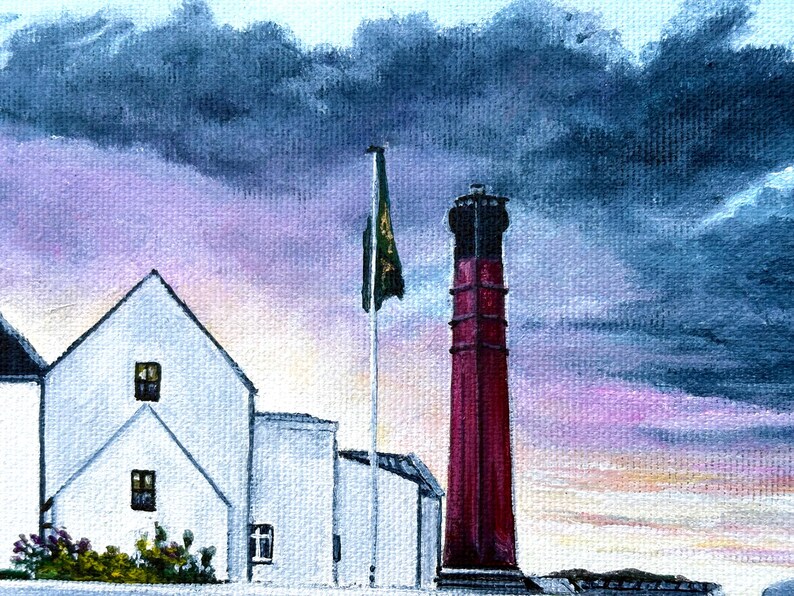 May include: An oil painting depicts a coastal scene with a white building and a tall, red lighthouse. A green and gold flag flies in the wind. The sky is a mix of purple, blue, and gray, suggesting a stormy day.
