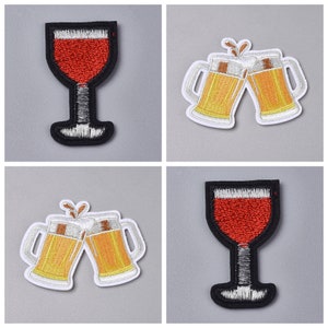 May include: Four embroidered iron-on patches featuring a wine glass and two beer mugs. The wine glass is red and the beer mugs are yellow. The patches are ideal for adding a touch of personality to clothing, bags, or other fabric items.