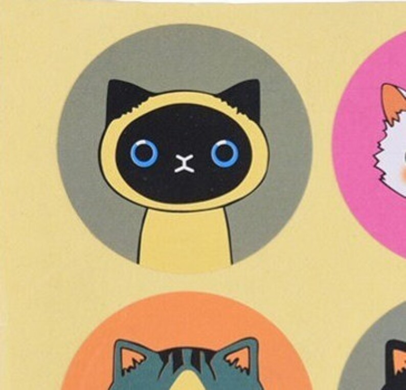 May include: A set of six round stickers featuring cartoon cats with different expressions. The stickers are on a yellow background.
