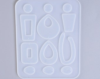 May include: A clear silicone mold for making earrings. The mold has 12 different shapes, including circles, ovals, rectangles, and teardrops.