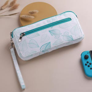 Étui de transport pour 2 Switch inspiré d'Animal Crossing - Porte-cartes de jeu léger, porté main et bandoulière - Convient pour Switch 2/OLED/Lite