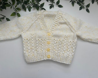 Baby’s yellow speckled hand knitted cardigan, personalise with name embroidered onto the back. Roughly fit 3/6 months