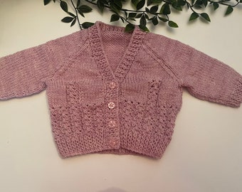 Baby’s dark dusty pink hand knitted cardigan, personalise with name embroidered onto the back. Roughly fit 3/6 months