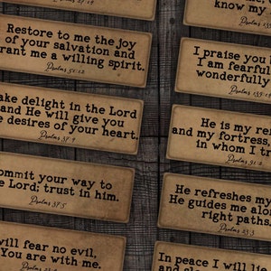 May include: A set of 12 vintage-style cards with inspirational quotes from the Bible, featuring the book of Psalms. Each card has a different quote and verse number printed on a brown background with a distressed texture.