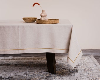 Linen Tablecloth in natural color with embroidery around its perimeter. Extra Long Tablecloth in custom sizes.