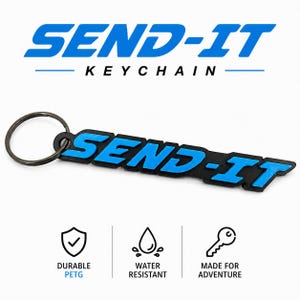 May include: Black and blue "SEND-IT" keychain with a keyring. The keychain has the words "SEND-IT" in blue, with the word "KEYCHAIN" below it. The keychain is durable, water-resistant, and made for adventure.