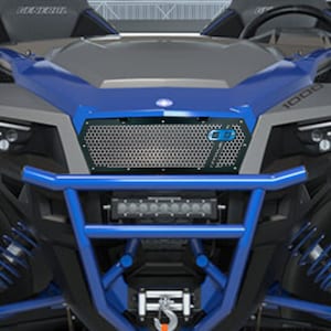 May include: Close-up of a black and silver off-road vehicle front end. The vehicle has a blue roll cage and accents. A black grill with a honeycomb pattern and the letters "GD" in blue is visible.