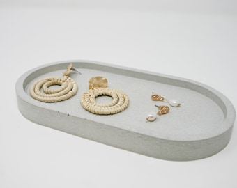 Grijs betonnen ovaal dienblad Gouden decoratieve onderzetter Sieradenschaal Betonplantenschotel