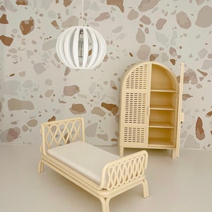 Rattan doll’s bed