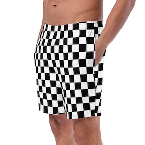 Op de afbeelding: Zwart-wit geblokte heren shorts. De shorts hebben een elastische tailleband met trekkoord en zijzakken.