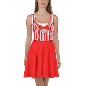 May include: A red skater dress with a white and red striped bodice and a red bow tie. The dress has a sleeveless design and a flared skirt. The bodice has a white undershirt.