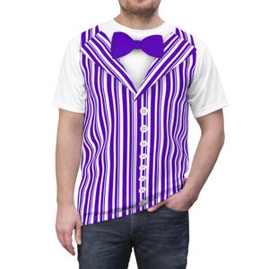 May include: White t-shirt with a printed design of a purple and white striped vest, a purple bow tie, and white buttons. The shirt is worn by a person wearing blue jeans.