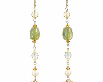 May include: A pair of long dangle earrings featuring gold-tone metal wire, clear faceted beads, large translucent green barrel-shaped beads, small yellow accent beads, and white pearls, ending in clusters of tiny yellow beads, measuring 4.5 inches long.