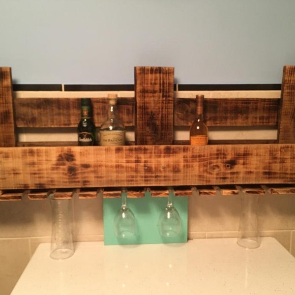 Floating shelf to hold bottles and glasses from recycled pallet wood