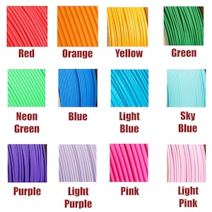 May include: A grid of colorful spools of filament for 3D printing. Colors include red, orange, yellow, green, neon green, blue, light blue, sky blue, purple, light purple, pink, and light pink. Each color is labeled with its name.
