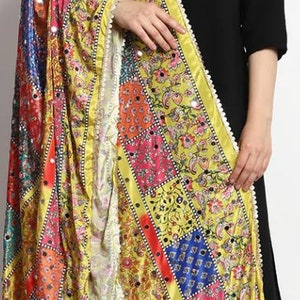 May include: A yellow, red, blue, and green patterned dupatta with mirror embellishments. The dupatta has a white border with a pearl-like trim.