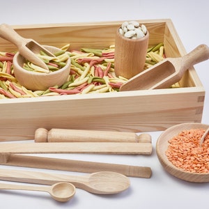 Wooden box filled with beans. Wooden sensory bin tools. Natural cotton bag.