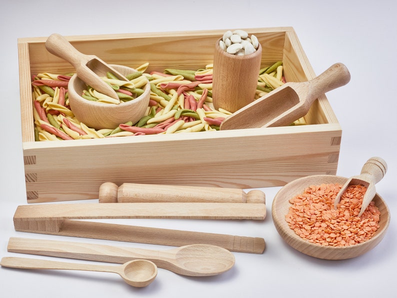 Wooden box filled with beans. Wooden sensory bin tools. Natural cotton bag.