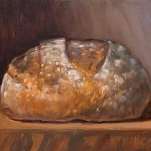 May include: An oil painting of a loaf of bread. The bread is a golden brown color with white accents, and sits on a wooden surface. The background is a dark brown and light brown color.