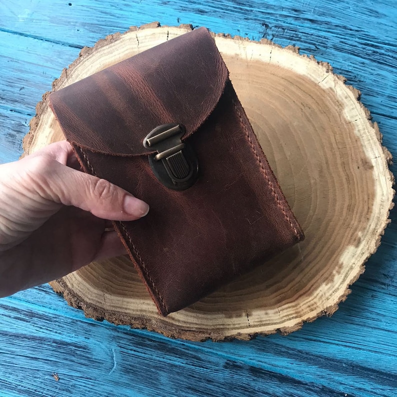 Leather tarot case with a flap closure, showcasing its durability and classic design.