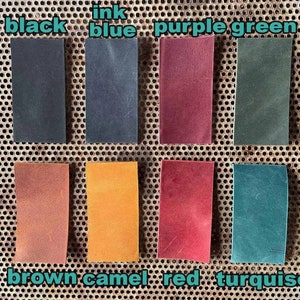 May include: Leather swatches in various colors, including black, blue, purple, green, brown, camel, red, and turquoise.