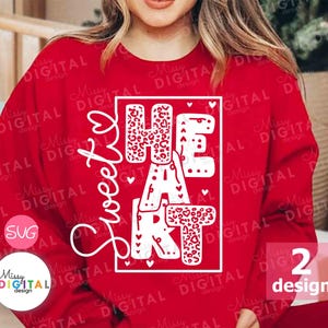 May include: Red sweatshirt with white text that says "Sweetheart" and a graphic of the word "HEART" with a leopard print pattern.