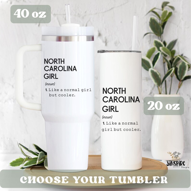 May include: Two white tumblers with straws, one 40 oz and one 20 oz, are displayed. Both tumblers have the text "NORTH CAROLINA GIRL" with a definition. The phrase "CHOOSE YOUR TUMBLER" is at the bottom.