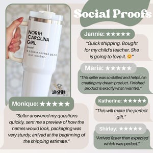 May include: A white insulated tumbler with a handle, featuring the text "NORTH CAROLINA GIRL" and the definition "I like a normal girl but cooler." The tumbler has a silver rim and a white lid. The product is held by a person.